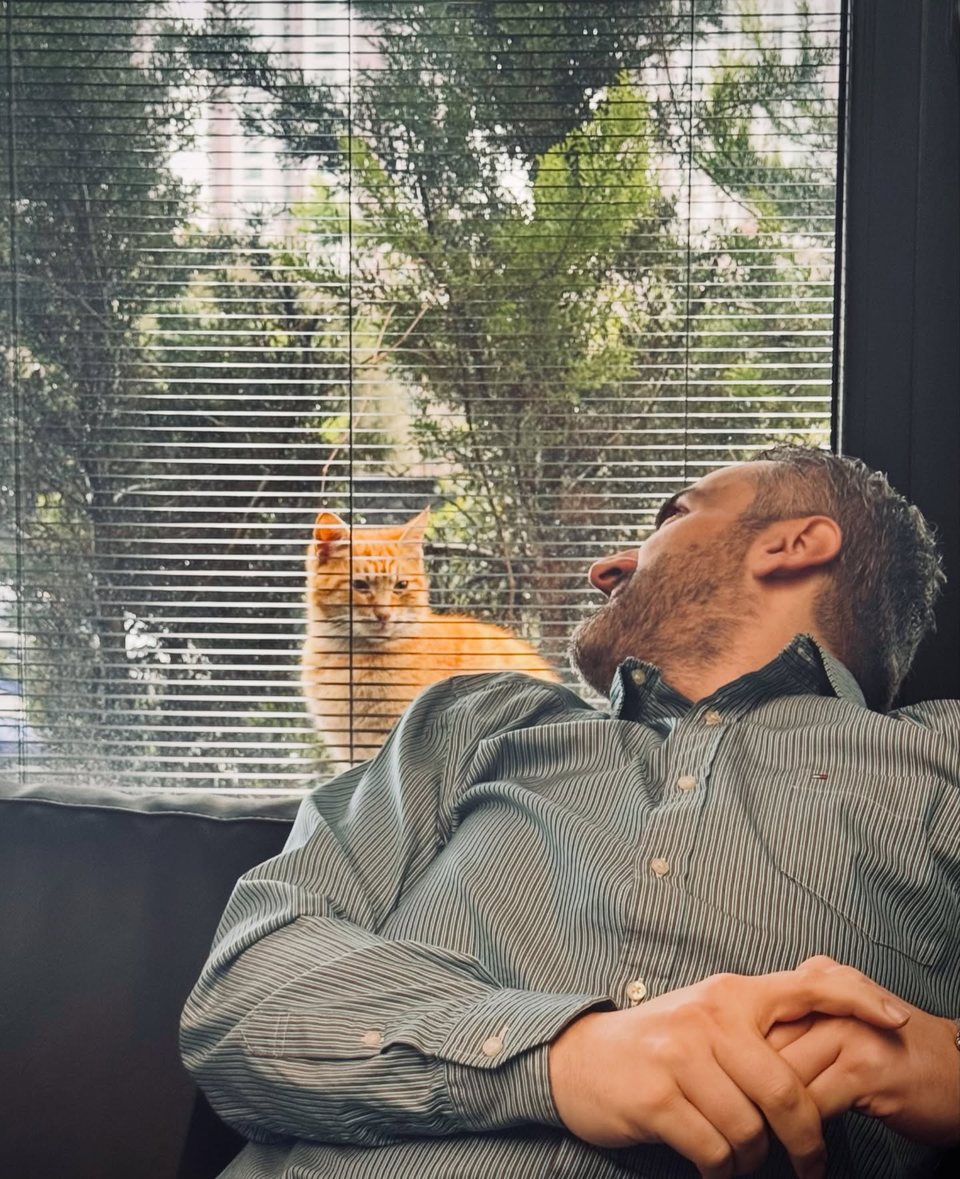 Servet Namlı sharing an everyday moment with his cat